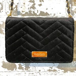 Chic black velvet crossbody bag from bebe featuring a classic quilted chevron
